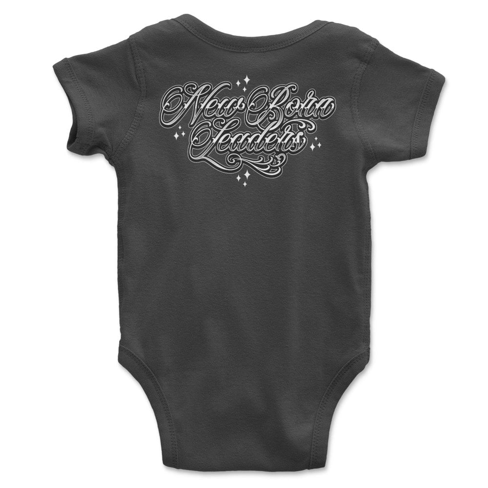Baby onesie with "New Born Leaders" in curly script letters printed on back.